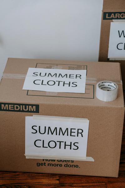 25 House Clearance Questions Answered - Your Complete Guide Moving boxes being packed during house clearance preparation